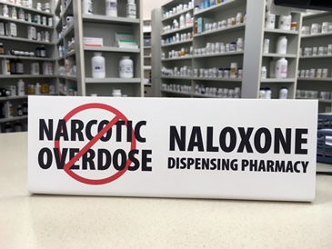 Naloxone sign in pharmacy