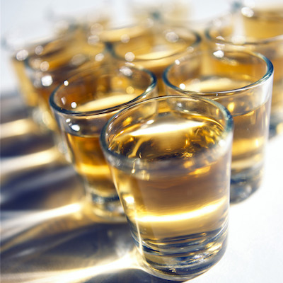 Stock photo of whiskey in shot glasses