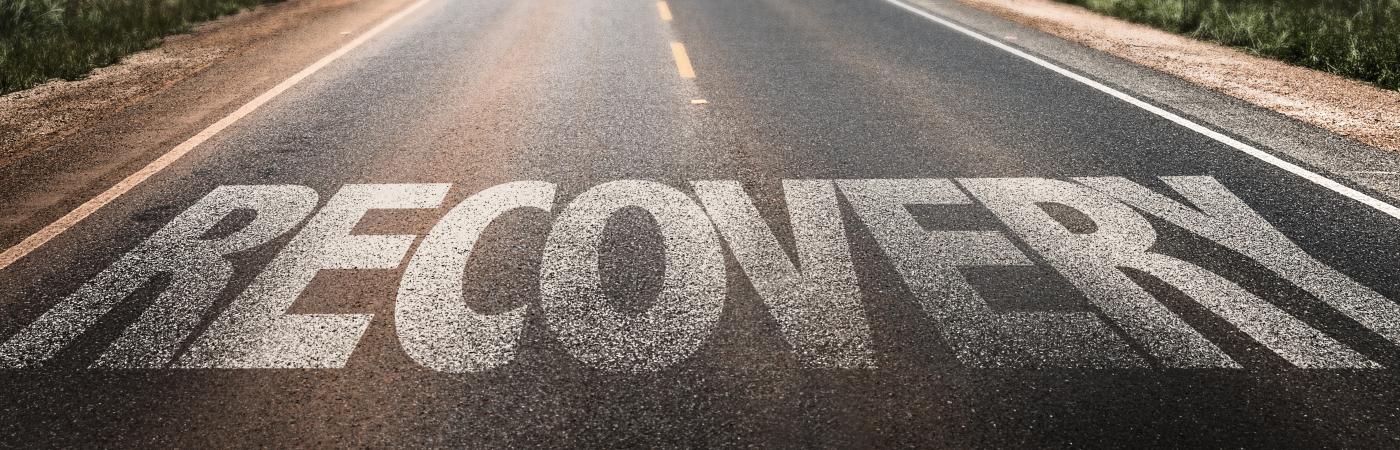recovery written on a road