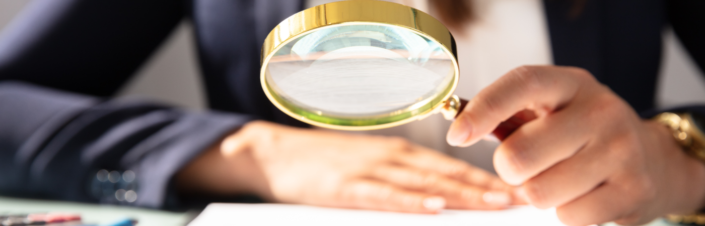 Woman with Magnifying Glass