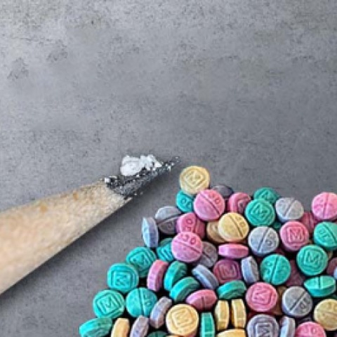 Fentanyl on pencil and rainbow fentanyl pills