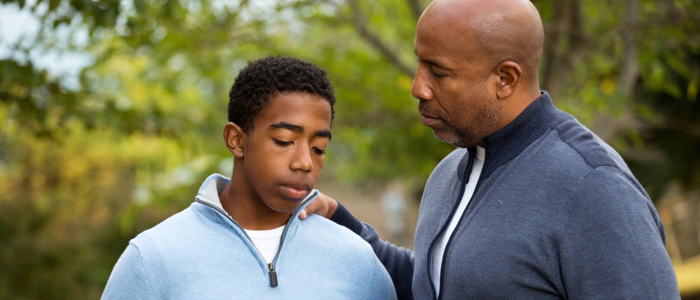 Adult talks to student