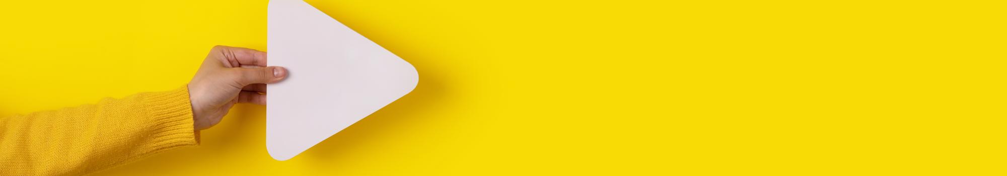 play icon on yellow background