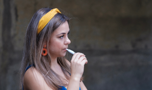Woman vapes